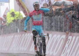 Race leader Vincenzo Nibali kisses his wedding ring after battling freezing conditions to win yesterday's penultimate stage. Picture: Getty
