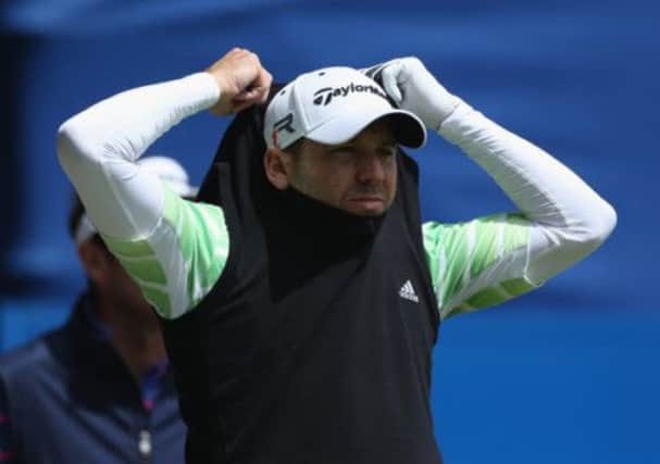 Sergio Garcia strips off his sweater as the sun comes out at Wentworth. Picture: Getty