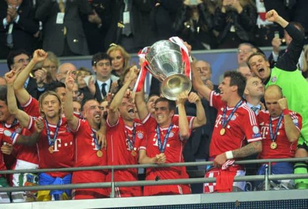 Bayern Munich players celebrate as they lift the UEFA Champions League trophy. Picture: PA