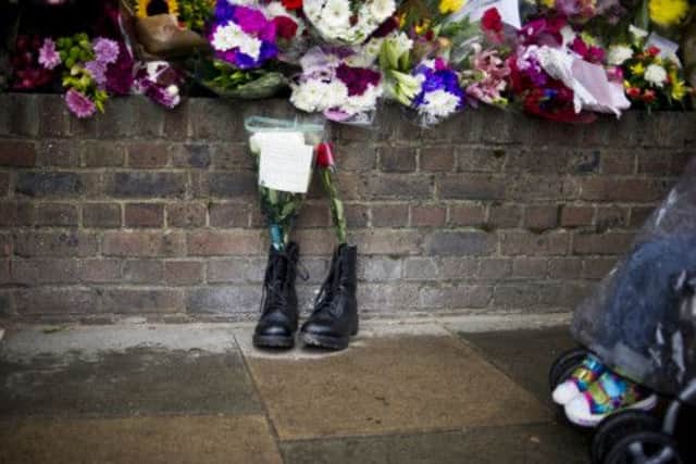 Boots laid in tribute outside the Woolwich Barracks following the murder of solder Lee Rigby. Picture: PA