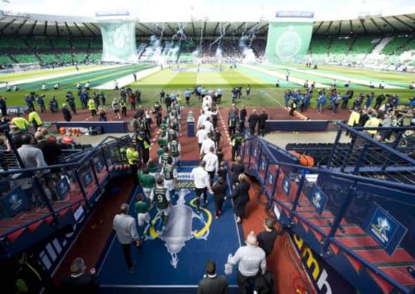 The teams come out of the Hampden tunnel. Picture: SNS