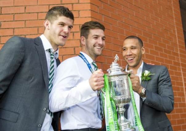 Fraser Forster, Charlie Mulgrew and Kelvin Wilson parade the Scottish Cup to the Celtic supporters. Picture: SNS
