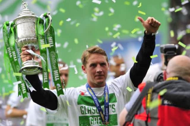 Kris Commons, seen here with the Scottish Cup, wants to spend more time with his family. Picture: Robert Perry