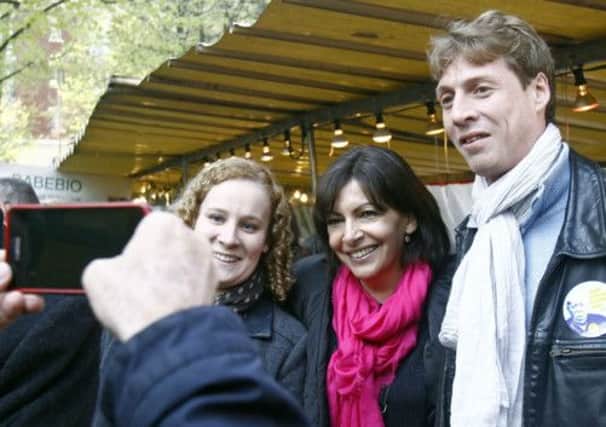 Socialist candidate, Anne Hidalgo (centre) poses for a snapshot. Picture: AP