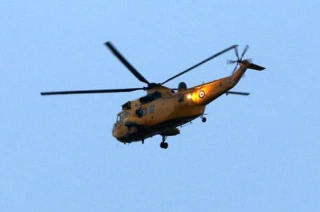 An RAF rescue helicopter helped mountain rescue teams in the search. Picture: PA