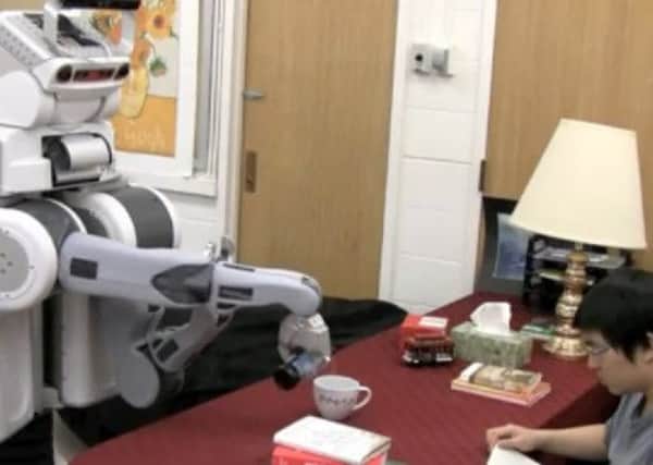 A screenshot of the robot pouring a beer. Picture: Youtube