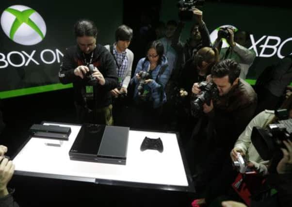 Photographers crowd around as the Xbox One is unveiled. Picture: AP