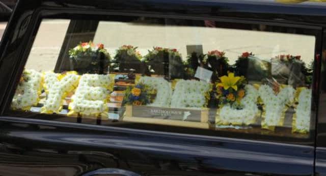 A floral tribute reading the words "Bye De Bye" on display at the funeral service of Paul Shane. Picture: PA