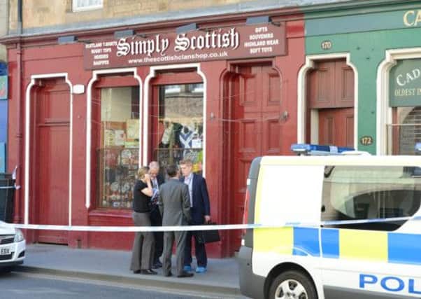 An area of the Canongate in Edinburgh was cordoned off after a 53 year-old was stabbed. Picture: TSPL