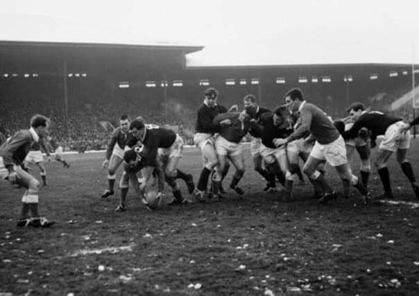 John Douglas tackles Alun Pask during Scotlands Five Nations game with Wales at Murrayfield in 1963. Picture: TSPL