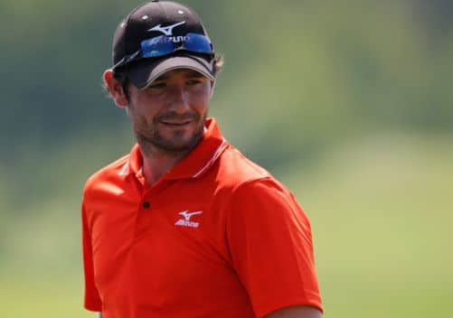 Peter Whiteford weighs up his putt at the 18th yesterday. Picture: Getty