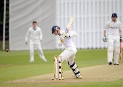 A watchful George Munsey lets the ball go by at Goldenacre during Granges winning innings of 291 against Heriots. Picture: Greg Macvean
