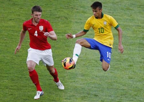 Neymar tries to evade Michael Carrick. Picture: Getty