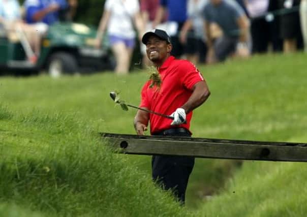 World No 1 Tiger Woods improved to a level par 72 following his disastrous 79 on Saturday. Picture: Reuters