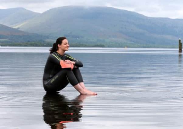 Keri-Anne Payne tests the waters of Loch Lomond as she launches the biggest open water swimming event in Scotland, the Great Scottish Swim. Picture: PA