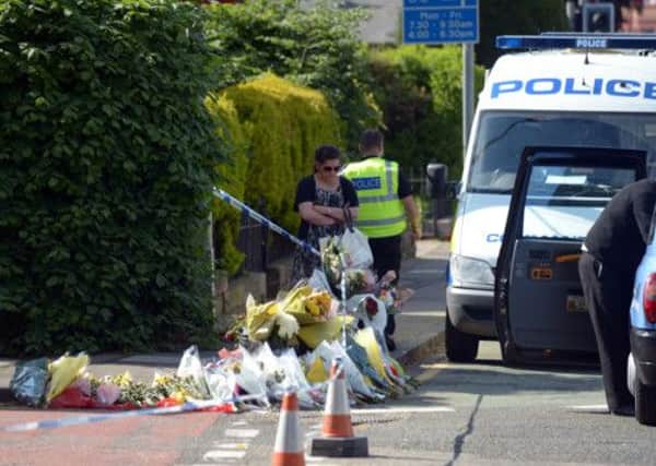 Flowers left at the scene of the incident which left Mohammed Abdi dead. Picture: PA
