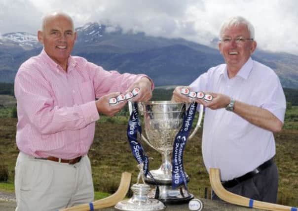 Camanachd Association president, Archie Robertson, and shinty historian Hugh Dan MacLennan with the cup at Spean Bridge. Picture: Contributed