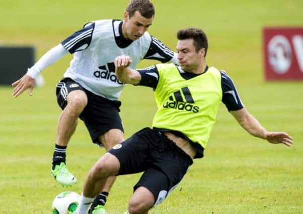 Defender Russell Martin, right, challenges Scotland team-mate James McArthur in training yesterday. Picture: SNS