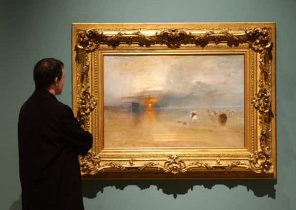Paul Kane of Glasgow City Council looks at a preview of the Turner Exhibition at the Burrell Collection in Glasgow. Picture: Getty