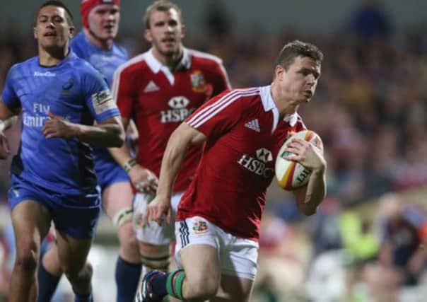 Brian O'Driscoll of the Lions breaks clear to score his second try. Picture: Getty