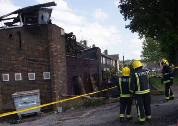 Firefighters aim hoses at the burnt-out remains of the alRahma Islamic centre in Muswell Hill, north London. Picture: PA