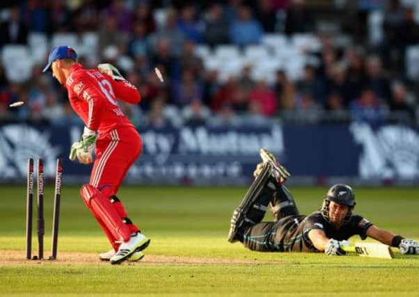 Ross Taylor of New Zealand survives a run out attempt as Jos Buttler of England looks on. Picture: Getty