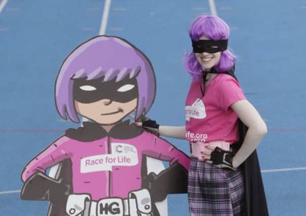 Fiona Longmuir, whose mum has survived ovarian cancer, pictured as Hit Girl. Picture: PA