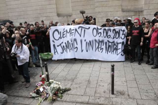 Protesters hold a sign reading "Clement 05/06/2013 - Forever one of ours" at the spot where the far-left activist was killed. Picture: AFP