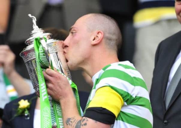Scott Brown pictured lifting the Scottish Cup last month. Picture: Robert Perry