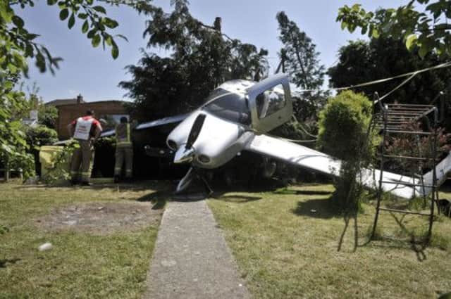 The Cirrus single-engine aircraft made a dramatic crash-landing in a back garden in Cheltenham. Picture: PA