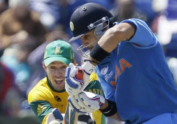 Indias Virat Kohli plays a delivery from the bowling of South Africas JP Duminy in Cardiff. Picture: AP
