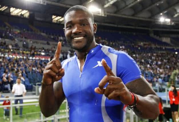 American sprinter Justin Gatlin celebrates after he inflicted a rare defeat on Usain Bolt in the 100m in Rome last night. Picture: Reuters