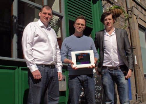 Robin Knox and Paul Walton flanking Meadow Bar owner Christian White. Picture: TSPL