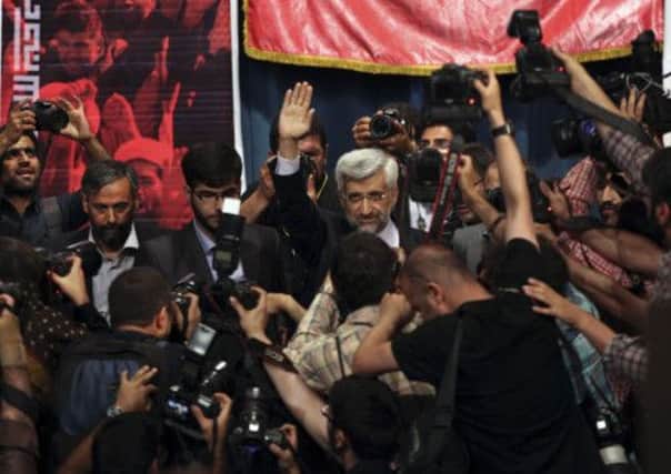 Iranian presidential candidate Saeed Jalili waves at the start of a campaign rally at Tehran University. Picture: AP