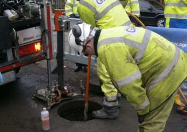 Scottish Gas engineers carrying out the innovative technique. Picture: Contributed