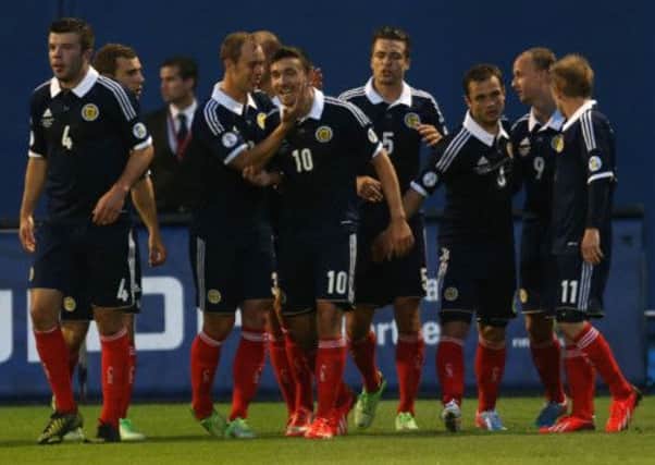 The Scotland team celebrate Snodgrass' goal. Picture: PA
