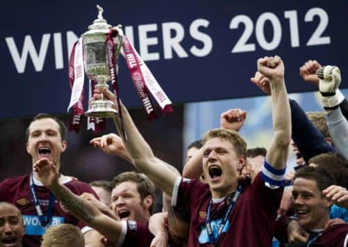 Hearts captain Marius Zaliukas celebrates his side's 5 - 1 victory over Hibs. Picture: SNS