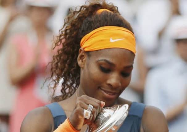 Serena Williams of the U.S. peers into her French Open trophy. Picture: Reuters