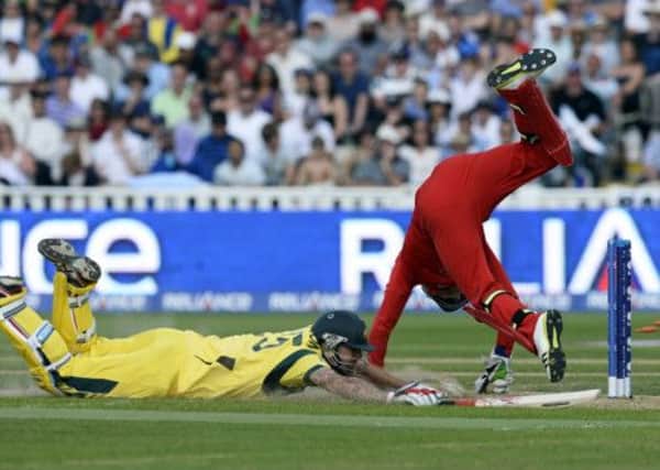 England's wicket keeper Jos Buttler tries to stump Australia's Mitchell Johnson. Picture: Getty