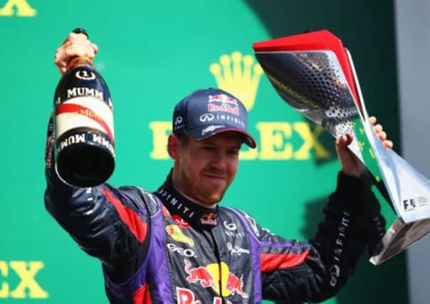 Sebastian Vettel celebrates on the podium after his Montreal victory. Picture: Getty