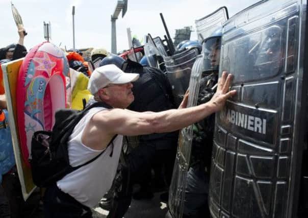 A protester clashes with police during the blockage of the Venice Tourist Port. Picture: Getty