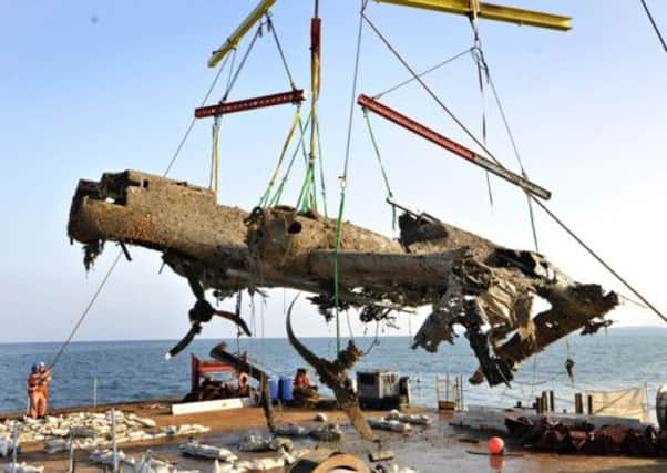 A Dornier 17 German bomber aircraft which crashed into the sea during World War Two is raised by a salvage crew. Picture: Reuters