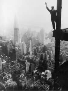 circa 1931:  A steel worker balances on a girder during the construction of the Empire State Building in New York City. The Chrysler Building can be seen in the background.  (Photo by Keystone/Getty Images)
