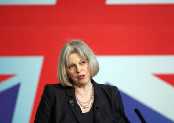 Home Secretary Theresa May in front of a Union flag. Picture: PA
