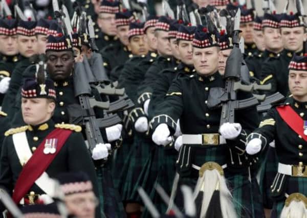 350 members of the Argyll and Sutherland Highlanders (5 SCOTS) parade through Port Glasgow. Picture: PA