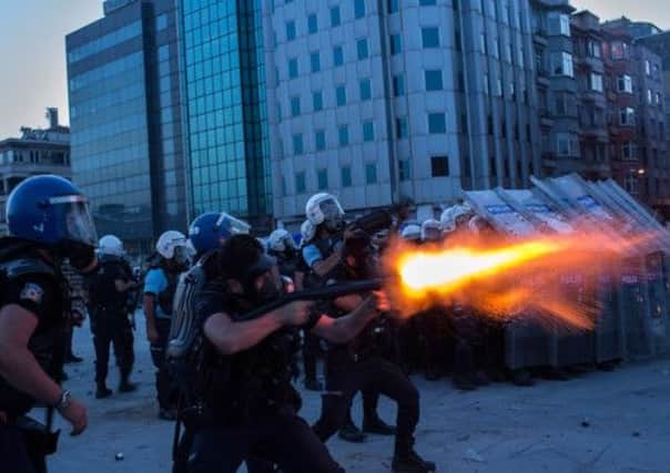 Riot police fire tear gas to disperse the crowd during a demonstration near Taksim Square. Picture: Getty