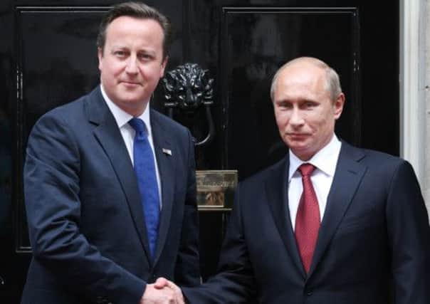 David Cameron and Vladimir Putin will hold talks over Syrian conflict. Picture: Getty