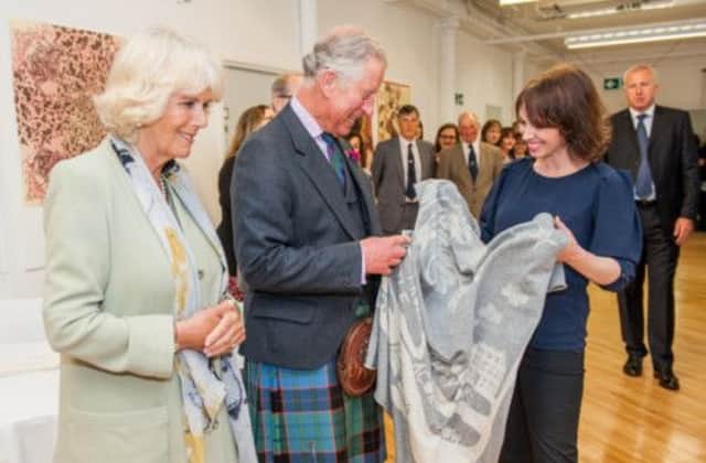 The Duke and Duchess of Rothesay appear delighted with the gift of a cashmere blanket for their grandchild. Picture: Ian Georgeson