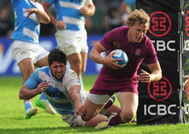 Billy Twelvetrees dives for the line during Englands first Test against Argentina. Picture: Getty