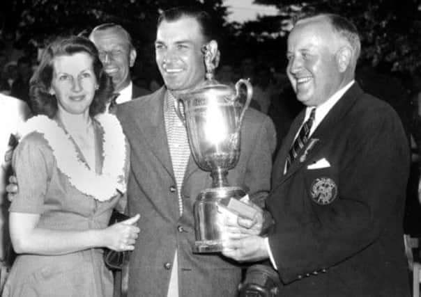 Ben Hogan, centre, with his wife Valerie, receives the US Open Golf Championship trophy in 1950. Picture: AP